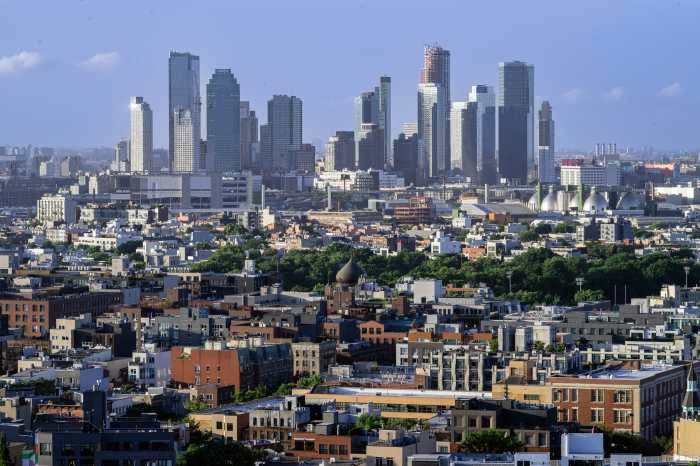 July 10, 2024, New York, NY, USA: View Across Williamsburg and Greenpoint to Long Island City in Queens, New York from Williamsburg, Brooklyn on a hot July afternoon. McCarren Park can be seen in the middle of the frame.