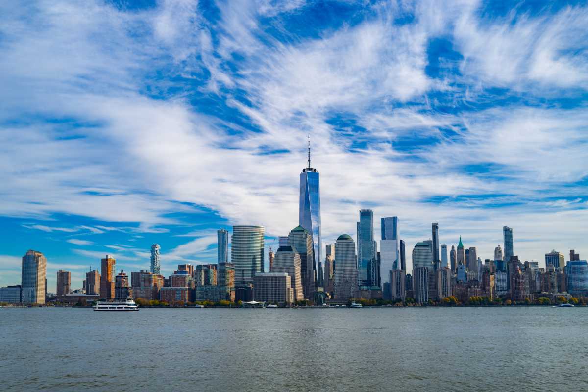 New York City skyline. NYC skyscrapers. Manhattan skyline. NY cityscape with clouds. Downtown New York buildings. NYC skyline, sky clouds. New York harbor view. Skyscrapers in Manhattan. NYC downtown