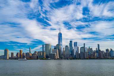 New York City skyline. NYC skyscrapers. Manhattan skyline. NY cityscape with clouds. Downtown New York buildings. NYC skyline, sky clouds. New York harbor view. Skyscrapers in Manhattan. NYC downtown