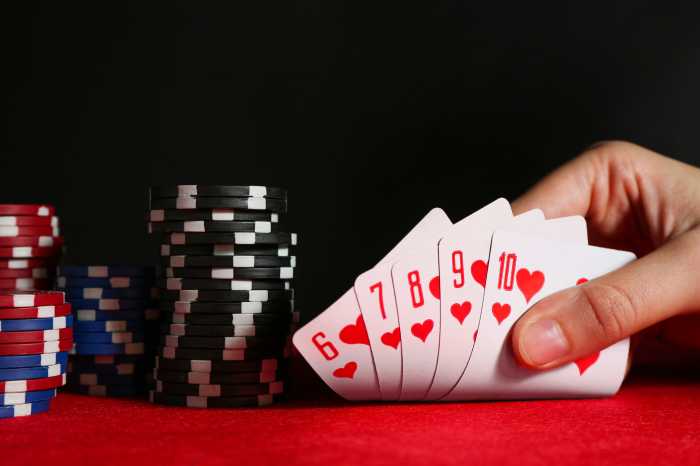 Woman holding cards at a casino