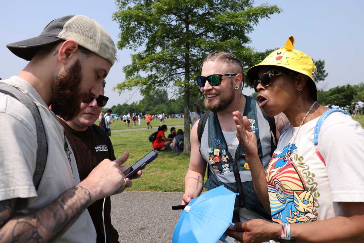 A group of players show off their latest catches at Pokémon GO Fest Jersey City 2025, Friday, June 6, 2025 in Jersey City, N.J. (Jason DeCrow/AP Content Services for Pokémon GO)