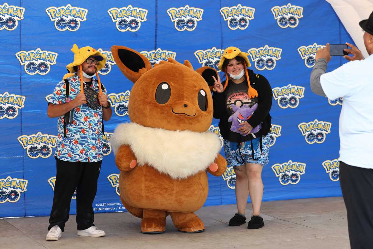 Attendees pose with Eevee at Pokémon GO Fest Jersey City 2025, Friday, June 6, 2025 in Jersey City, N.J. (Jason DeCrow/AP Content Services for Pokémon GO)