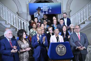 City Council members with administrators announce passage of new budget