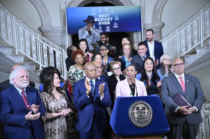 City Council members with administrators announce passage of new budget