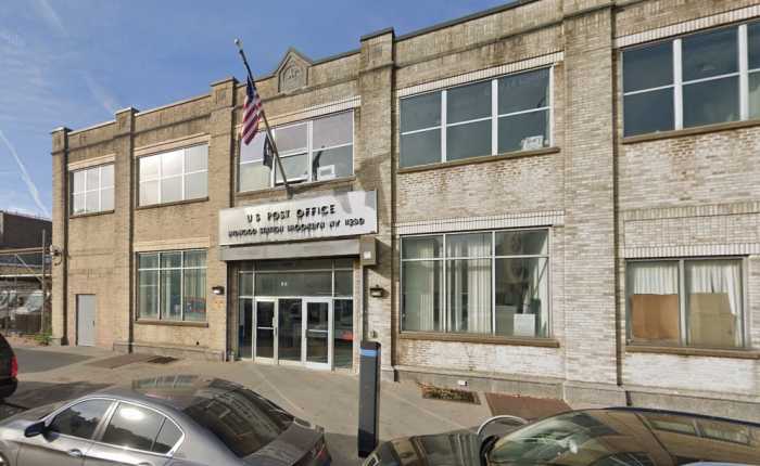 us post office building with cars parked in front in Brooklyn