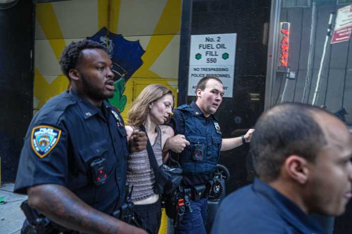 police officers escort person away from mass shooting scene