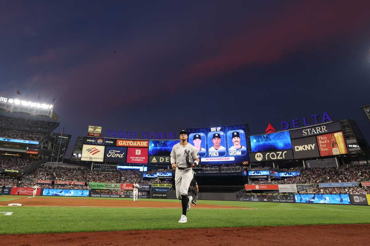 Jul 25, 2025; Bronx, New York, USA; New York Yankees right fielder Aaron Judge (99) runs in after the top of the fifth inning against the Philadelphia Phillies at Yankee Stadium.