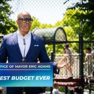 Mayor Adams says he 'wishes' he could use executive orders to skirt laws he disagrees with 26 man in sunglasses speaking at podium reading Office of Mayor Eric Adams Best Budget Ever