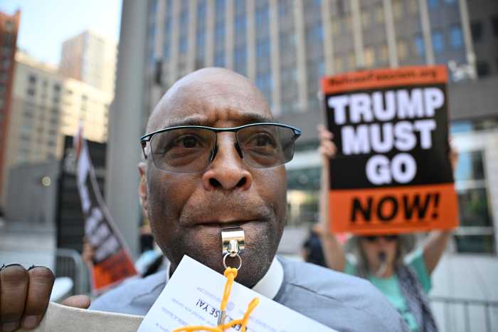 Blowing the whistle on ICE: Rev. Saint-Pierre joins demonstrators calling for an end to detentions