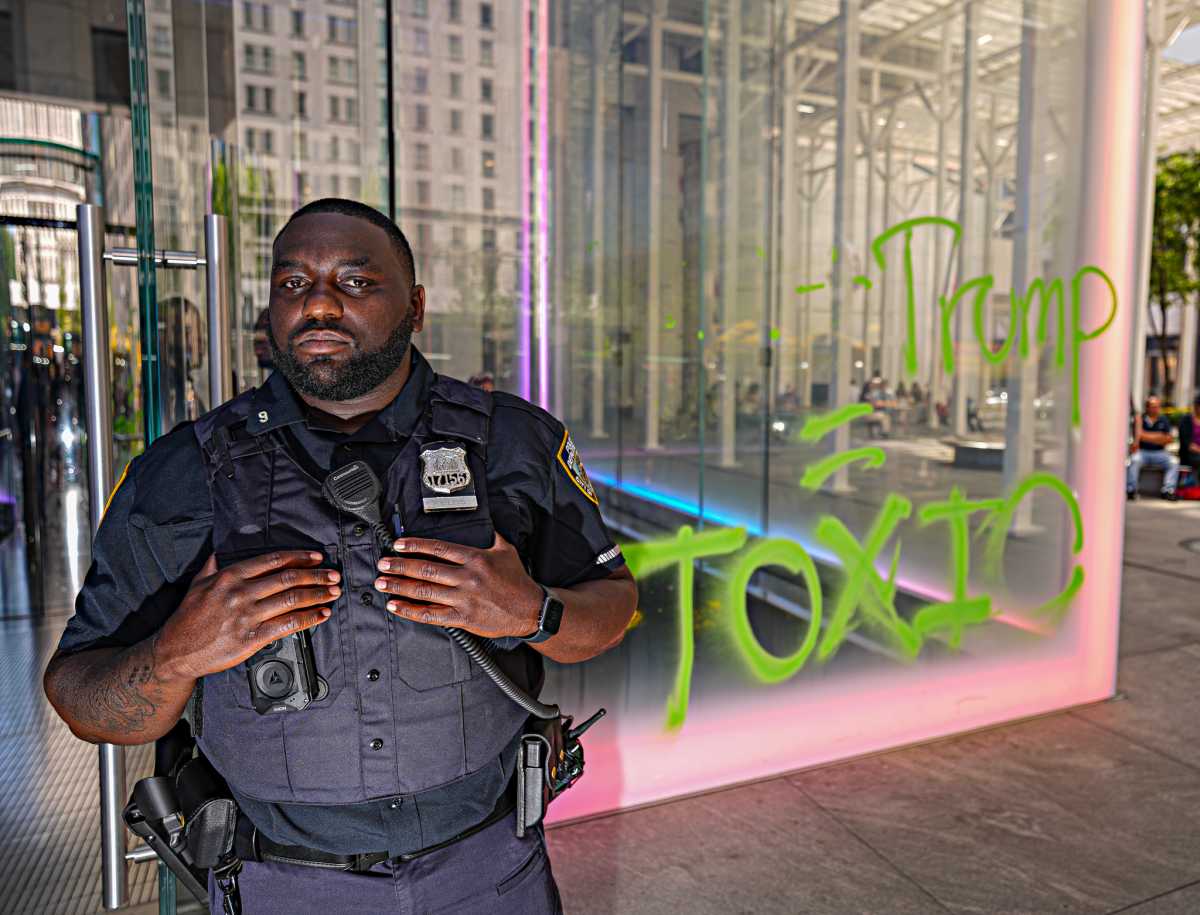Activist arrested spray-painting Midtown Apple store in protest over climate change and Trump 3