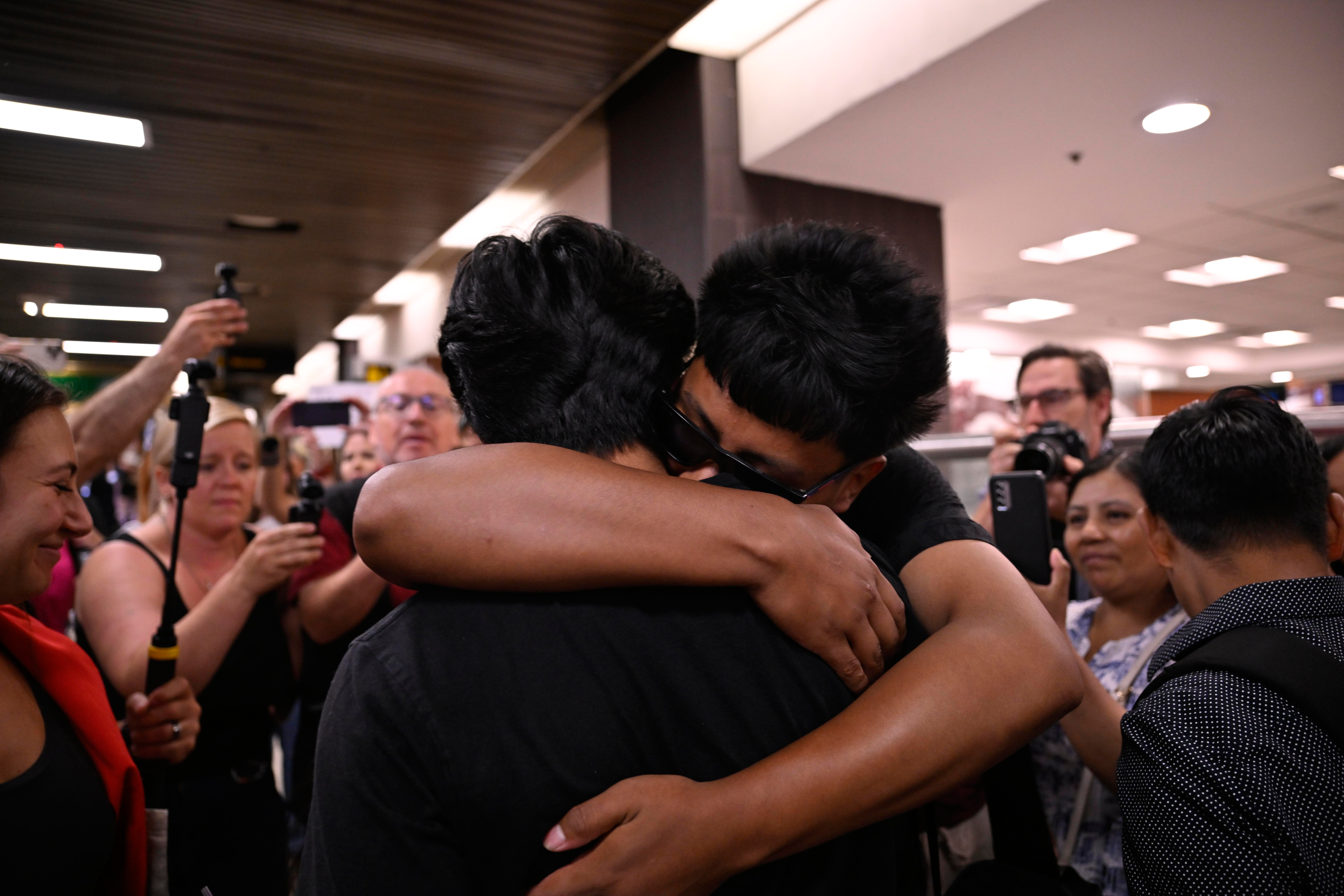 Queens teen reunites with family after month-long ICE detention in Texas 5 Derlis embracing family upon his return.