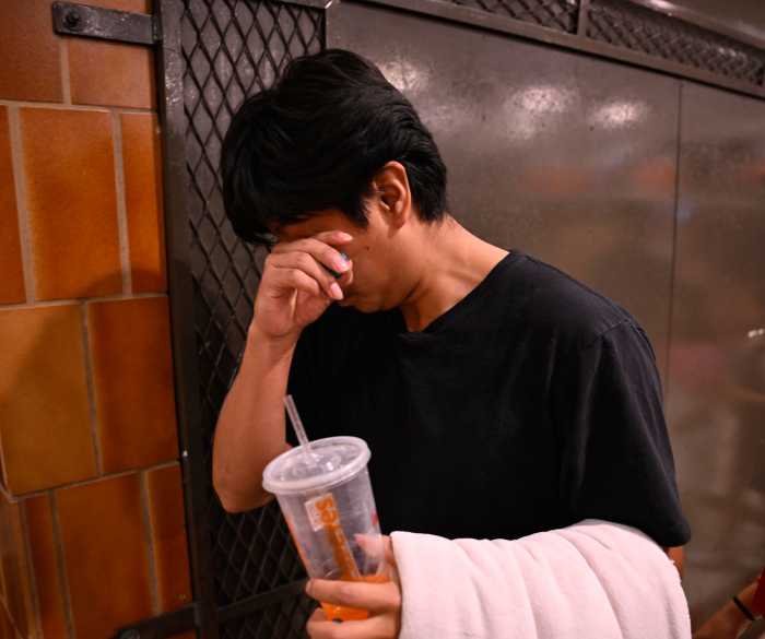 Derlis a takes a quiet moment to himself shortly after an emotional reunion with his family