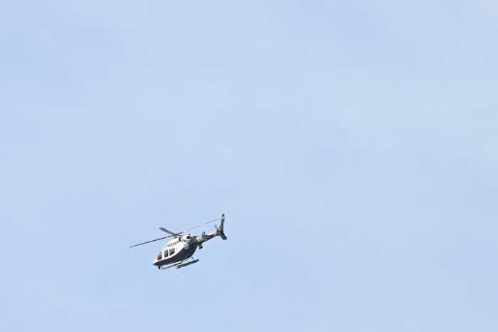 An NYPD Helicopter searches for the shooting suspect near the victim's East Flatbush residence