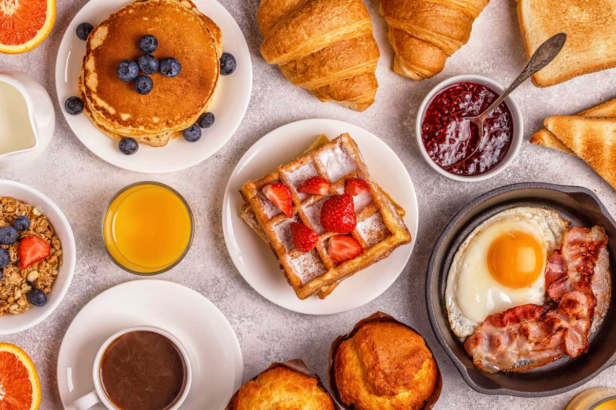 Delicious breakfast on a light table. Top view, copy space.