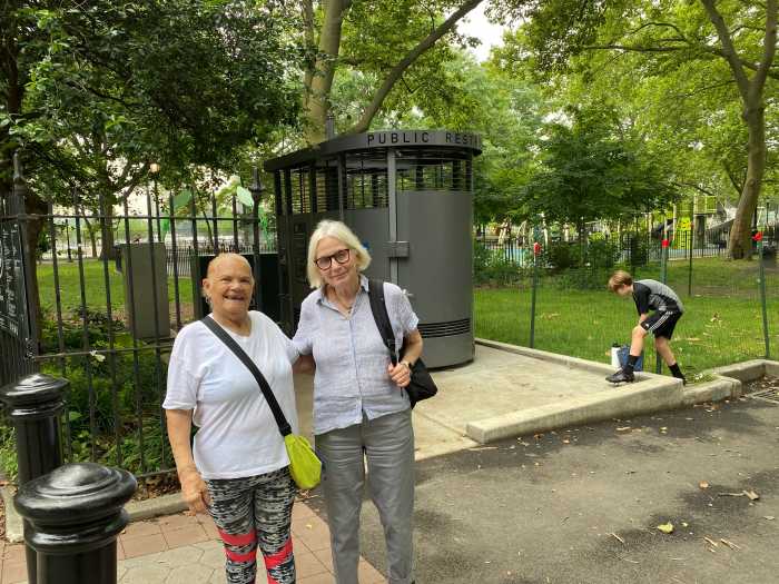 Antje and Maria, known as Greeny, share a laugh after checking out the new Portland Loo
