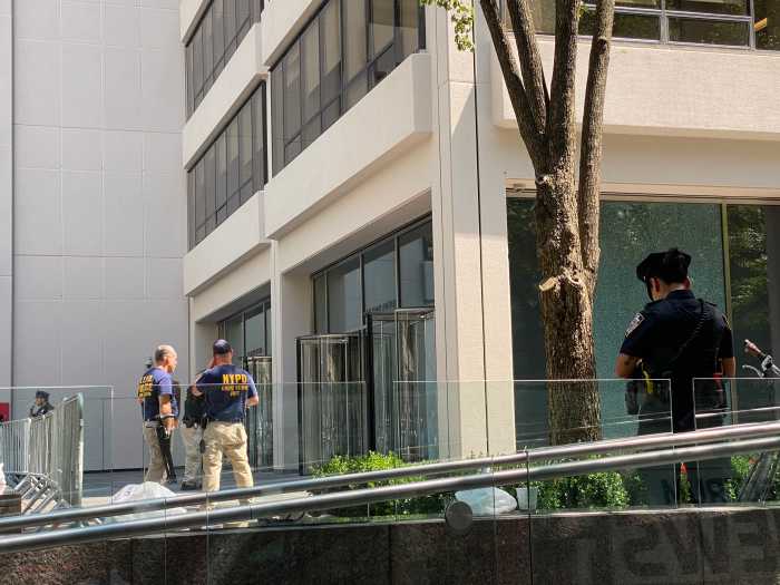 NYPD’s crime scene unit were observed combing the plaza outside 345 Park Ave.
