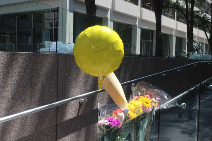 MIDTOWN MASS SHOOTING: Life resumes under eerie calm near Park Avenue office building the day after tragedy unfolded 4 A memorial of flowers and a balloon reading “Love One Another” sits outside 345 Park Ave., honoring the victims of Monday’s deadly shooting.