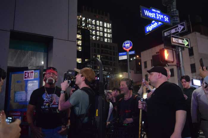 Pro wrestling legend Hulk Hogan visits Slam, a new sports bar bearing his name, during a walkthrough at the under-construction venue across from Madison Square Garden earlier this month.