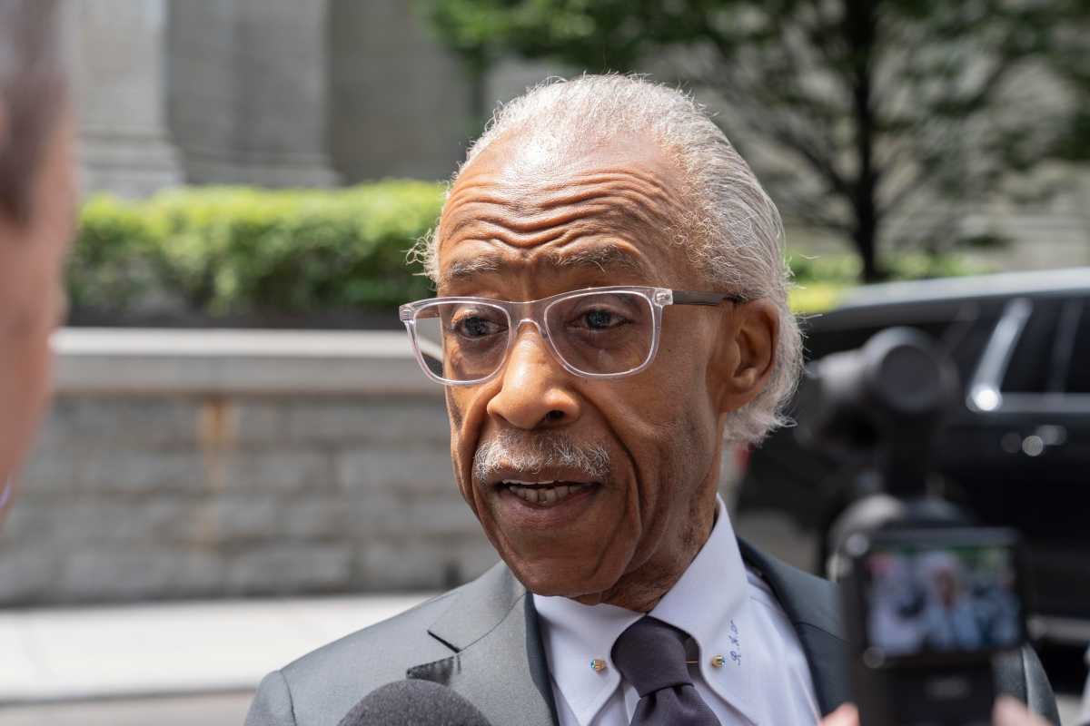 man in glasses speaking
