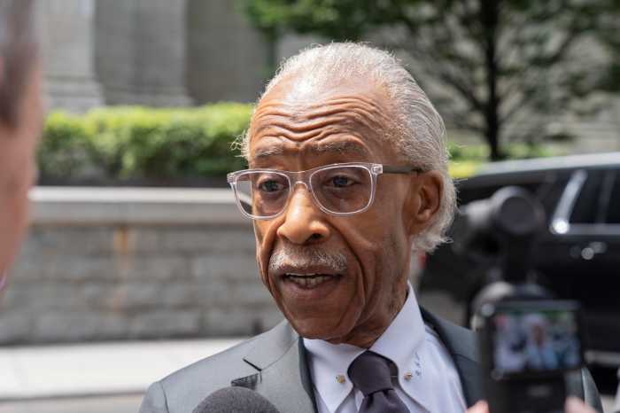 man in glasses speaking