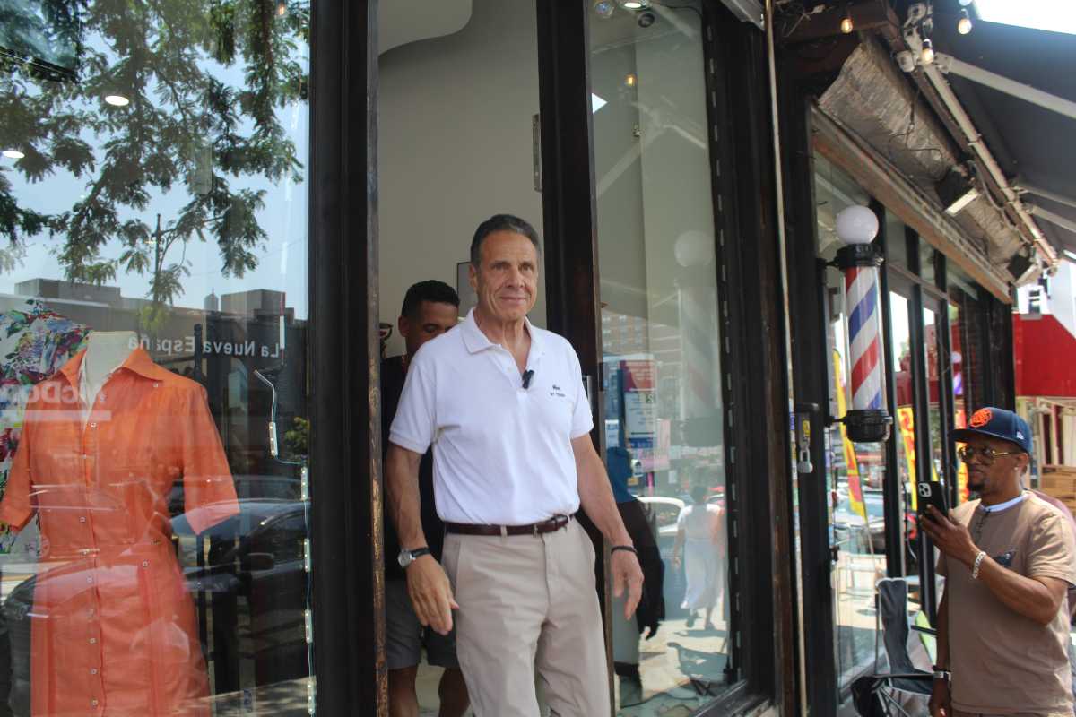 NYC Mayor's Race: A September surprise? Key voting date could be the day one of Mamdani's moderate challengers drops out - or not 2 man in white shirt and slacks exits store in mayor's race andrew cuomo