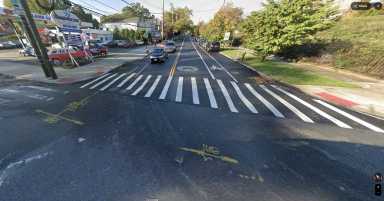 asphalt street and a crosswalk