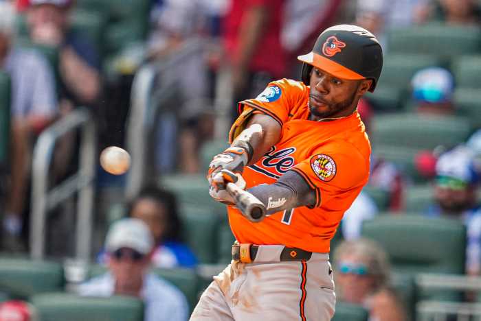 Cedric Mullins Orioles Mets trade: Baseball player in orange uniform connects for home run