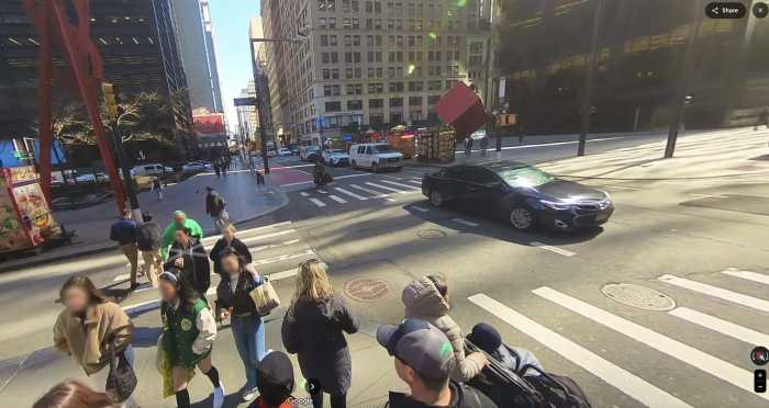 a group of people on street corners during the day in NYC