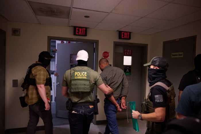 ICE in courts: More immigrants cuffed at Federal Plaza as even officers feel the strain 2 man getting arrested by officers inside a federal building