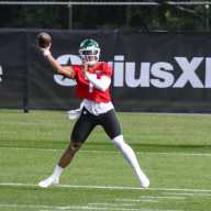 Justin Fields' cohesiveness among things to watch at Jets training camp 2025 28 Justin Fields Jets: Football player with green helmet and red jersey throws football