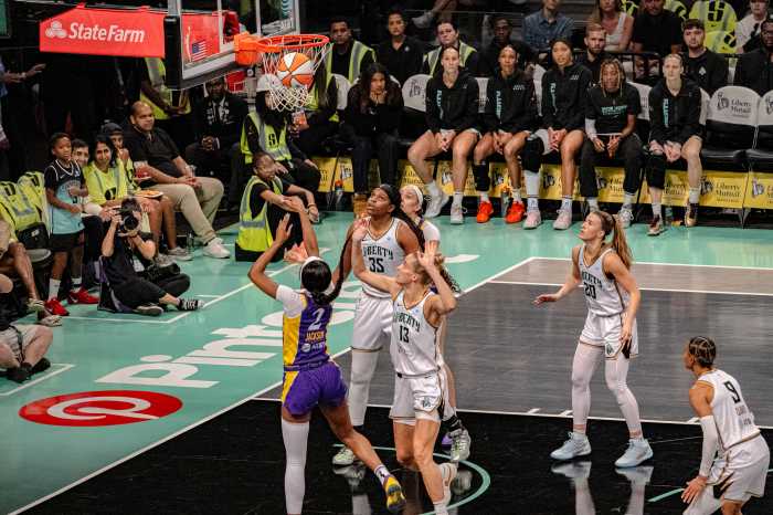 women's basketball players scramble for the ball Liberty and Sparks