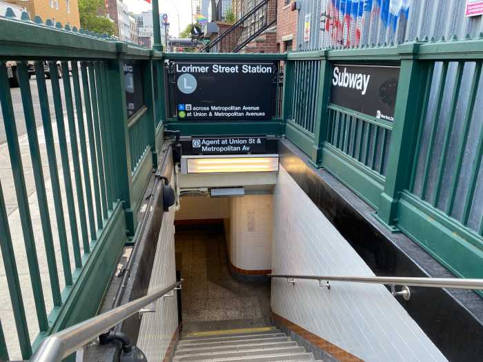 the entrance to a subway station with stairs