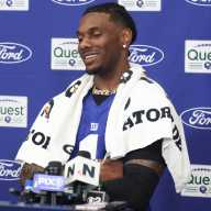 Malik Nabers injury: Giants star WR no guarantee for Week 1 of 2026 season 12 Malik Nabers: Giants player with white towel around his neck in front of blue background