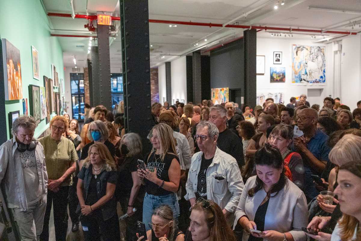 People in a crowd at art exhibit