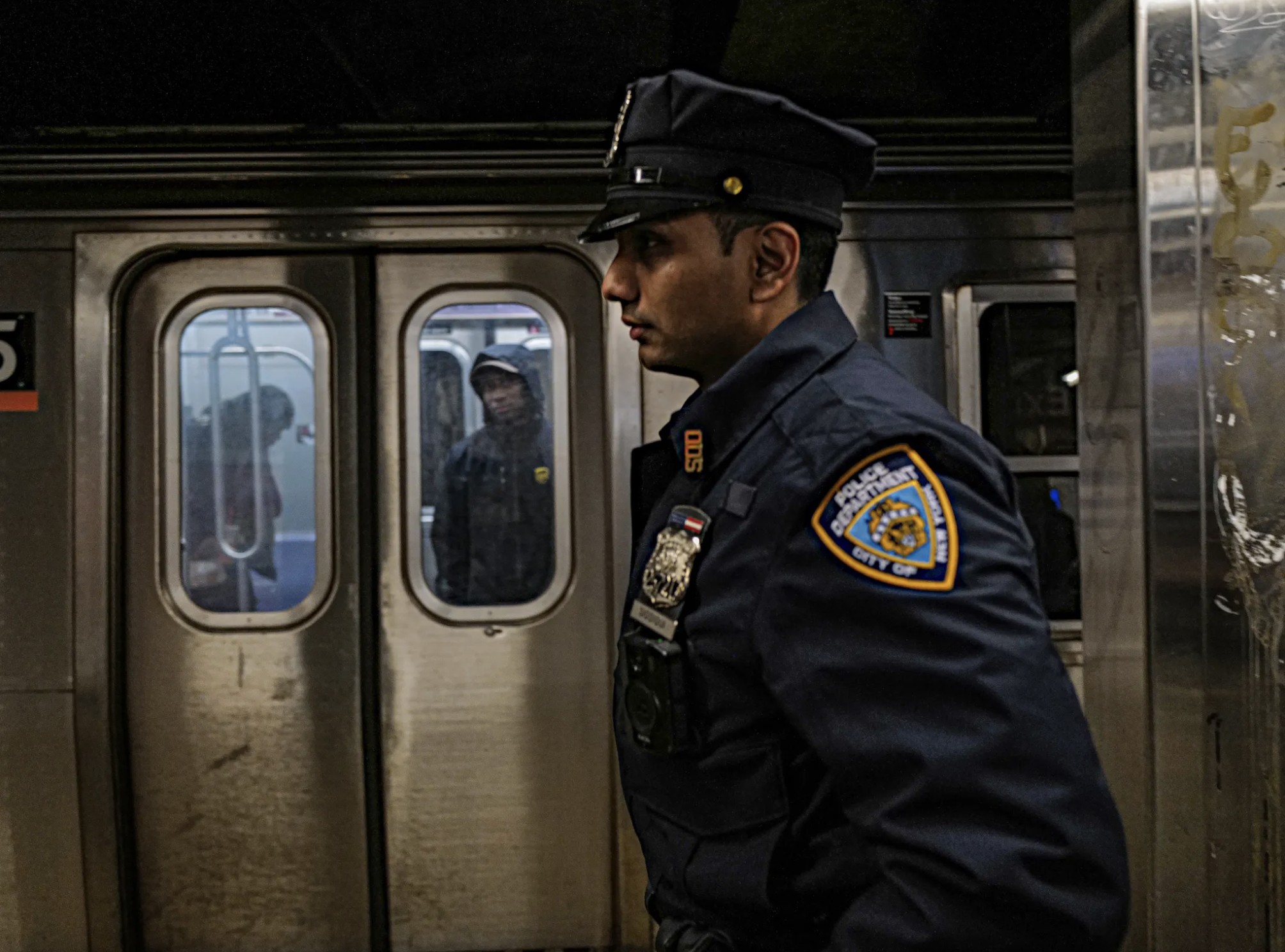 cop on a subway platform
