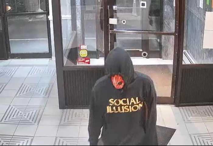 Police are on the hunt for a masked man who scaled a Staten Island apartment building before breaking into a residence and making off with $180,000 in cash.