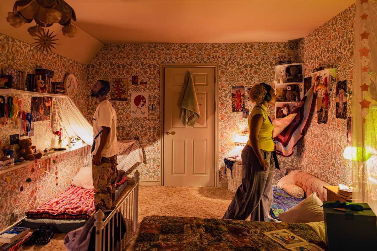 two people in interactive room with earphones on in interactive show "Viola's Room"