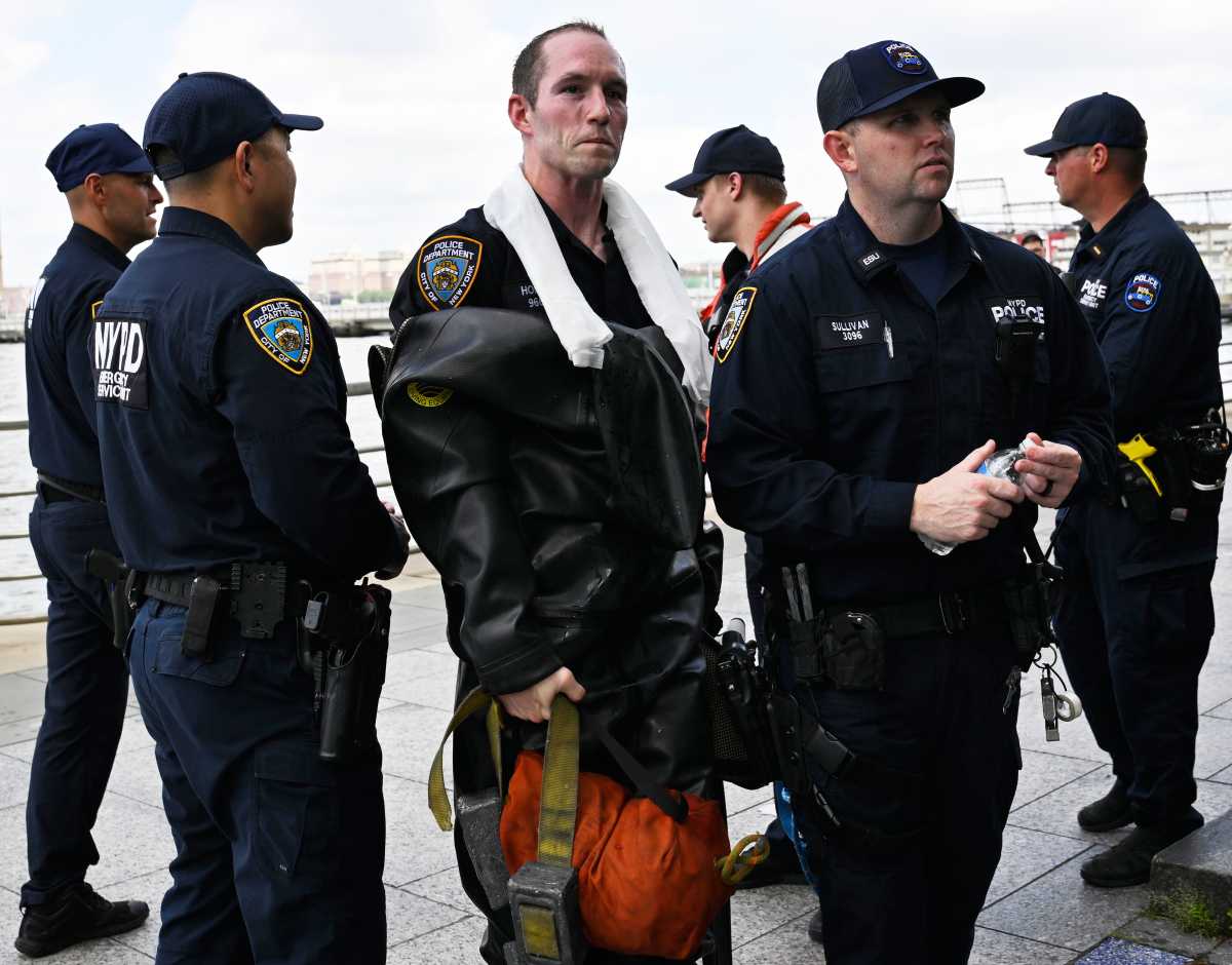 First responders in uniform and wet after Hudson River water rescue