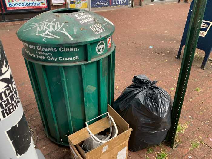 an outdoor public trash basket