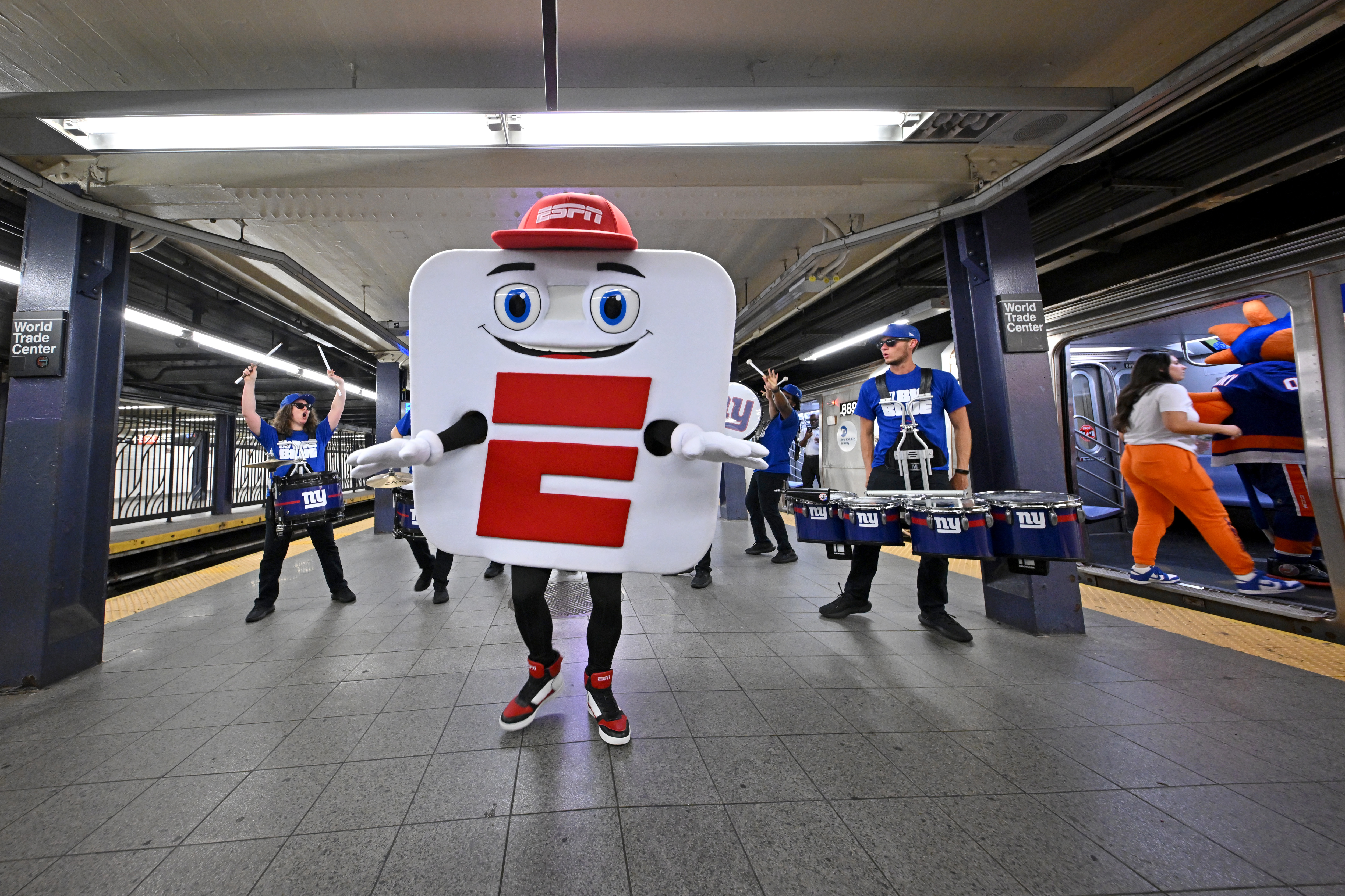 The New York Giants G-Line drumline, Mascot App-E and ESPN celebrate the launch of the new ESPN app with a "E" train takeover on August 21, 2025 in New York City. 
