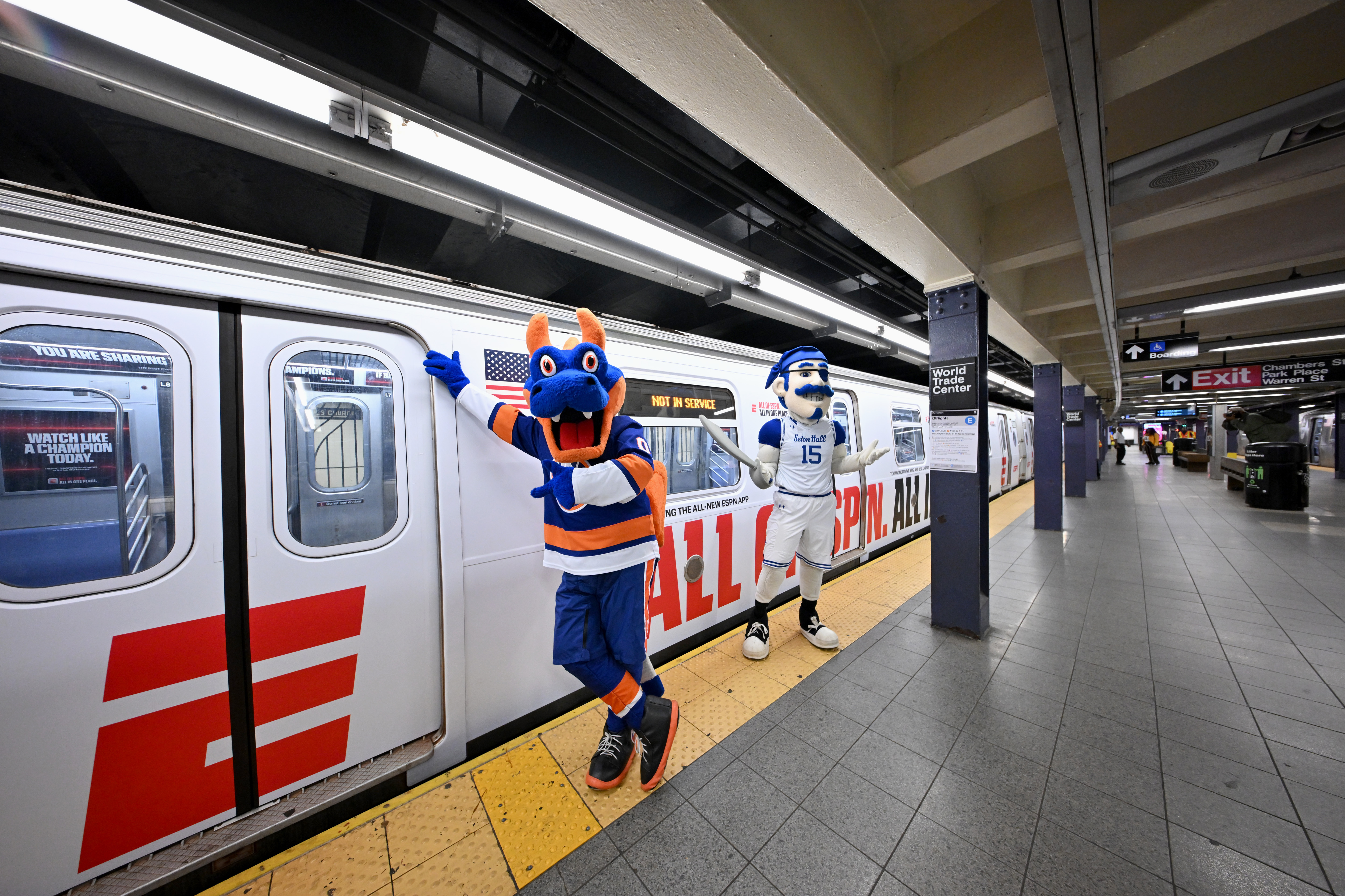 Sparky the Dragon, mascot for the New York Islanders, and The Pirate, mascot for the Seton Hall Pirates, join ESPN in celebrating the launch of the new ESPN app with a "E" train takeover on August 21, 2025 in New York City.