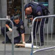 Times Square scare: Cops clear area after man leaves suspicious package outside of NYPD station 15 Police in Times Square examine suspicious package left behind near station.