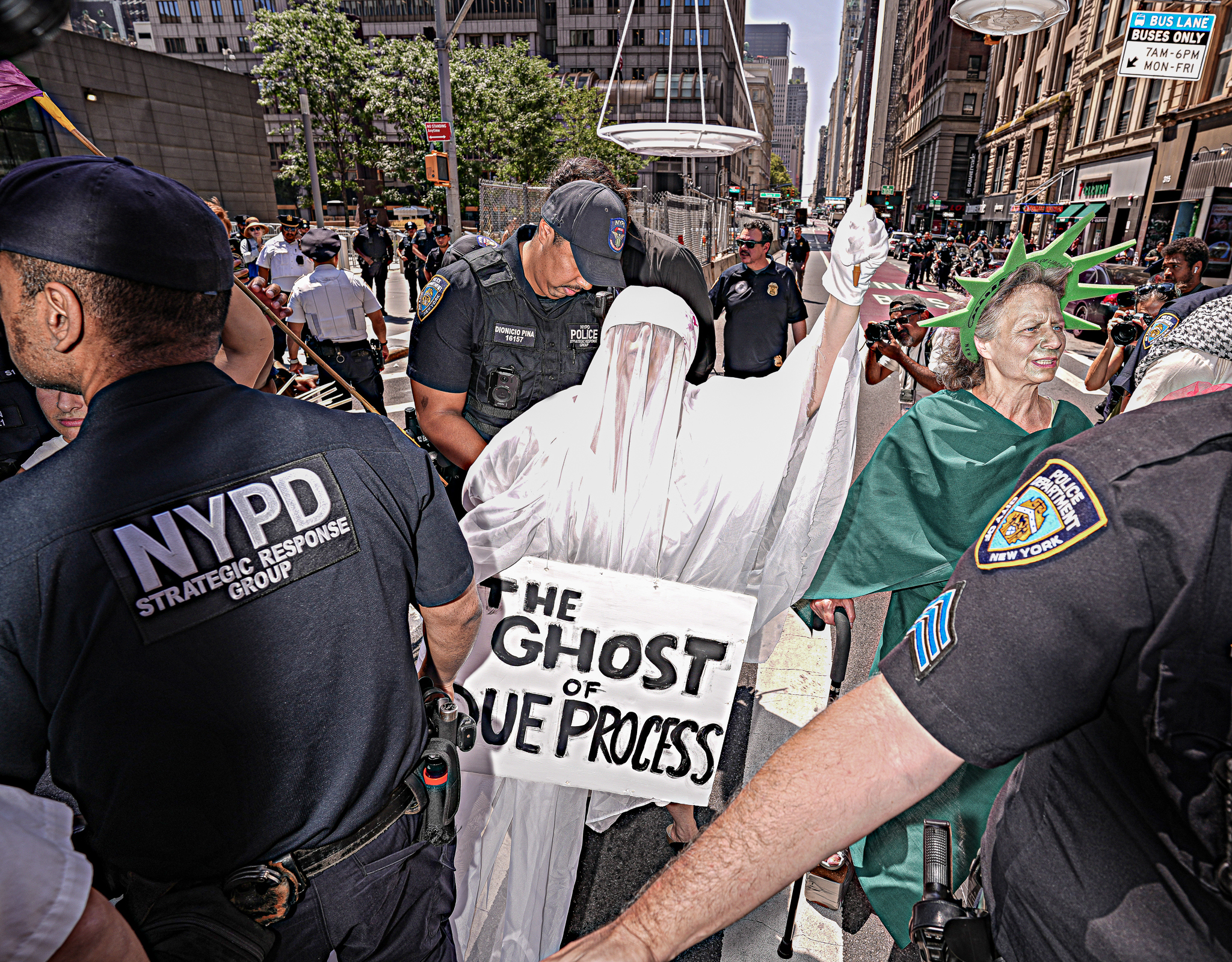 A handful of protesters dressed as the Statue of Liberty and Lady Justice were arrested in front of Lower Manhattan’s immigration court Monday in protest of ICE.