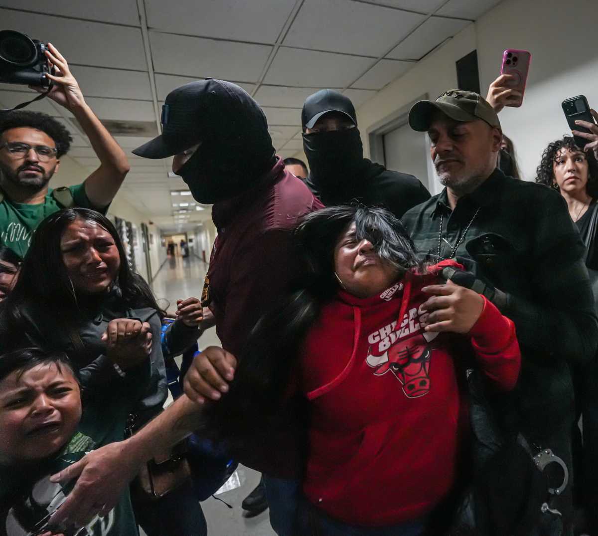ICE agents pull away man from his family