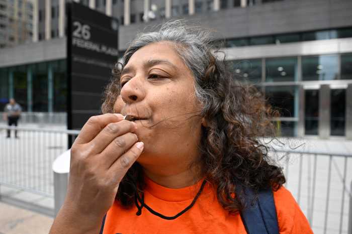 Coco Das 'blows the whistle on ICE' during a protest outside 26 Federal Plaza. Das, a member of the editorial collective at RefuseFascism.org, joined demonstrators calling for an end to ICE detentions and denouncing what she described as a “fascist regime.”