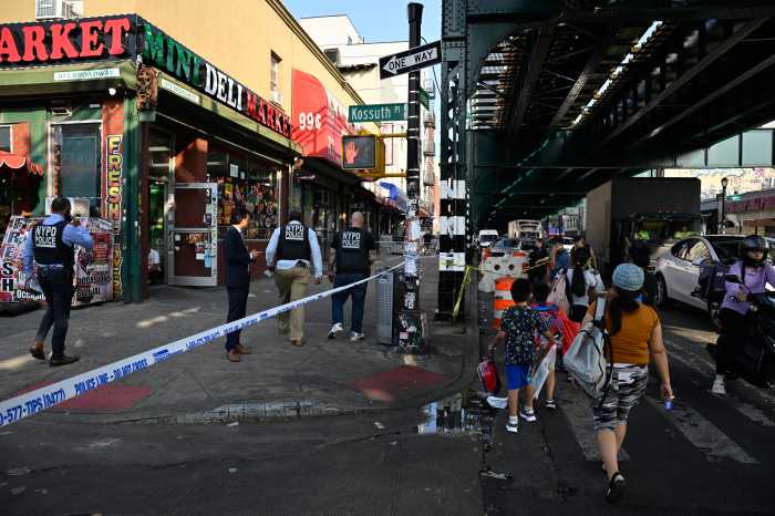 Detectives from the 83 Precinct investigate a shooting at Broadway Avenue and Kossuth Place. The victim was left in critical condition.