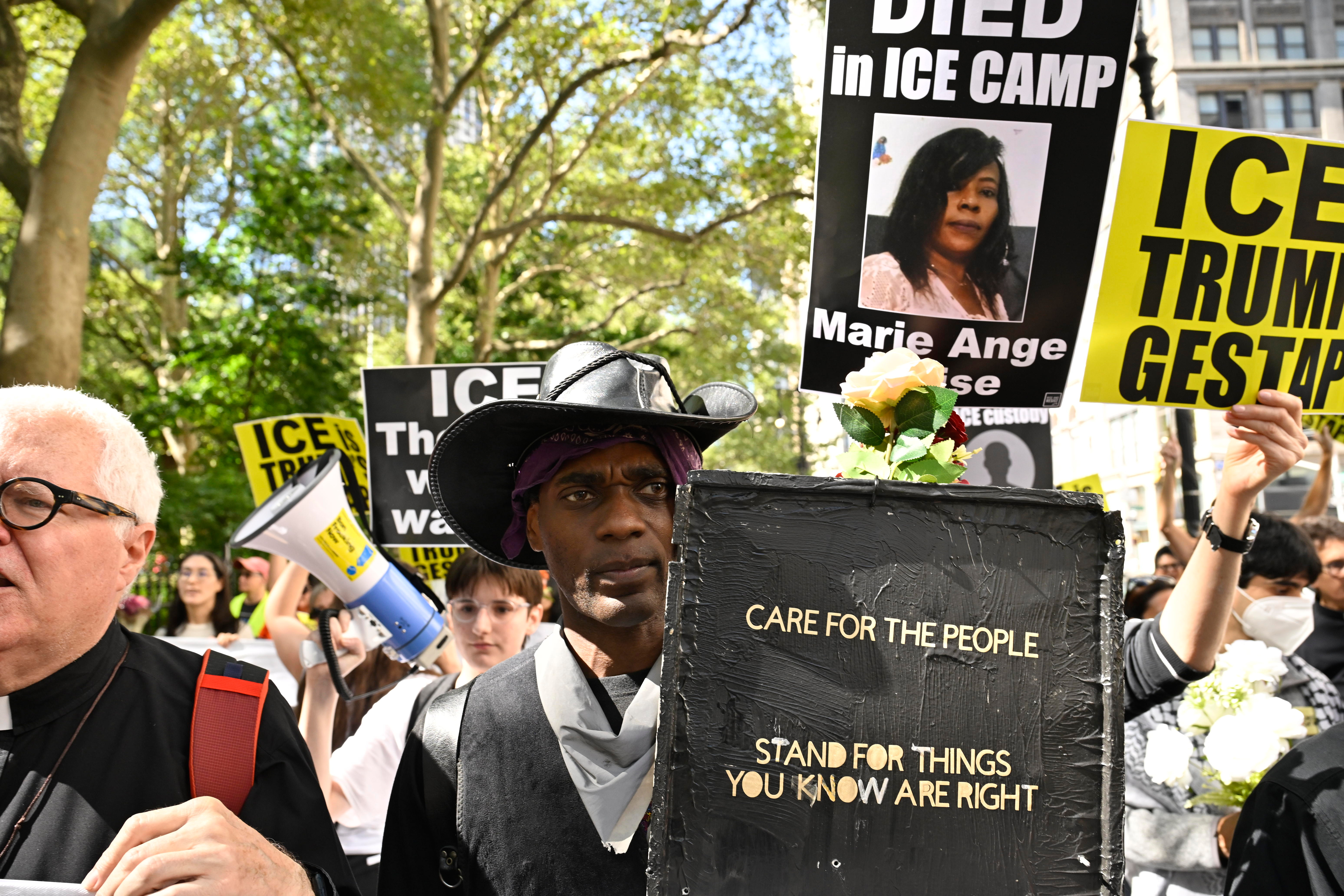 People protest ICE at 26 Federal Plaza.