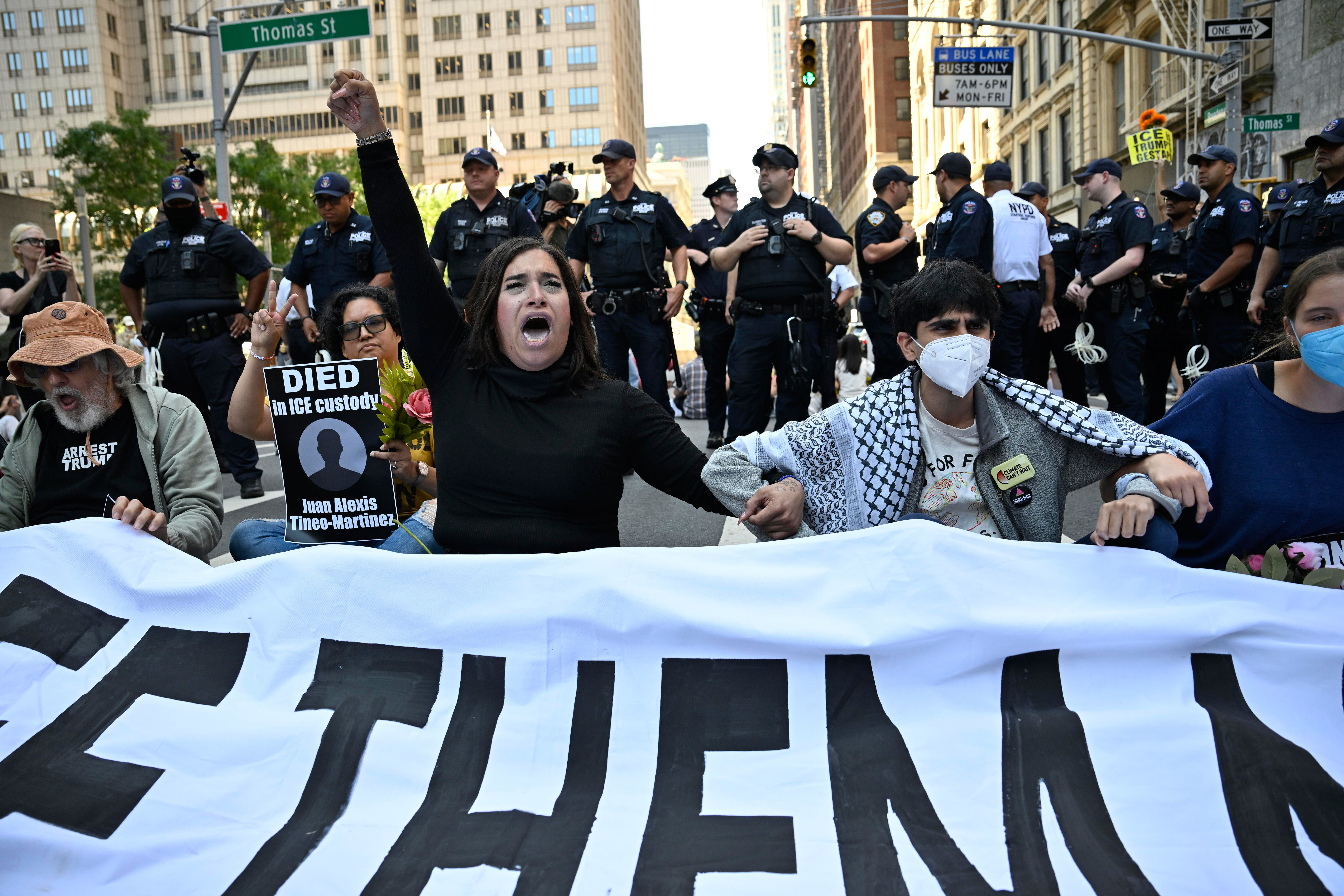 People protest ICE at 26 Federal Plaza.