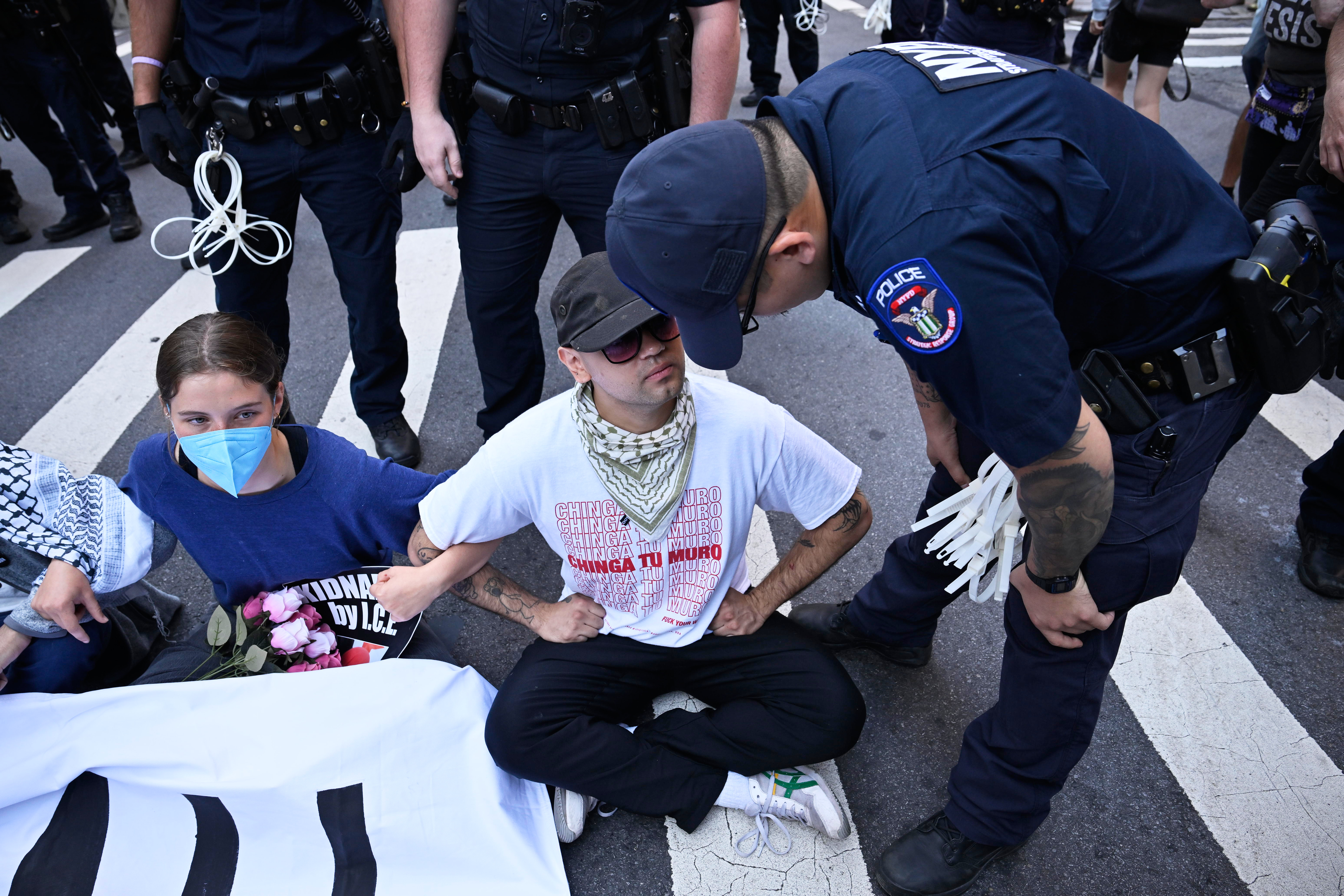 People protest ICE at 26 Federal Plaza.