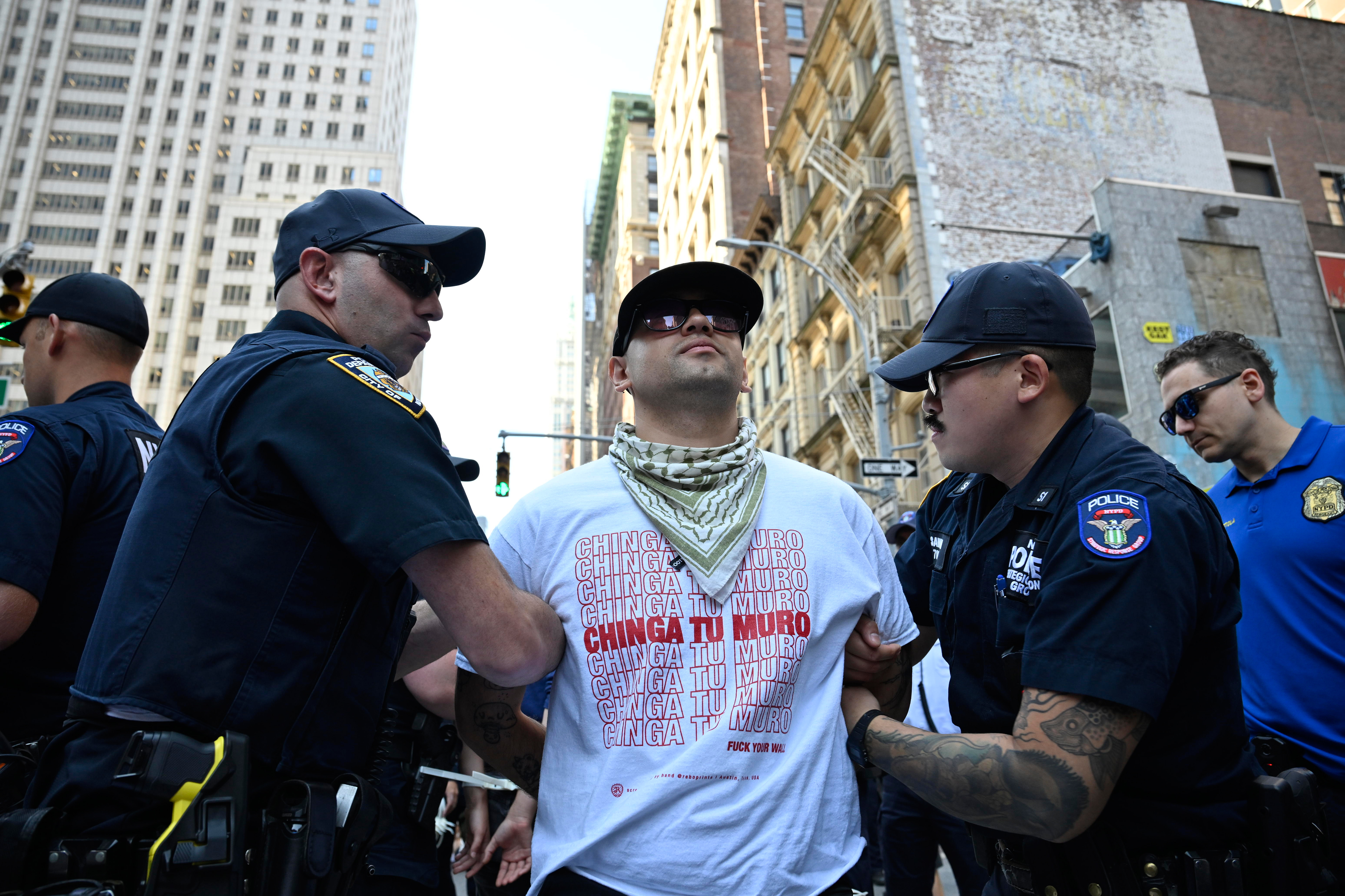 People protest ICE at 26 Federal Plaza.